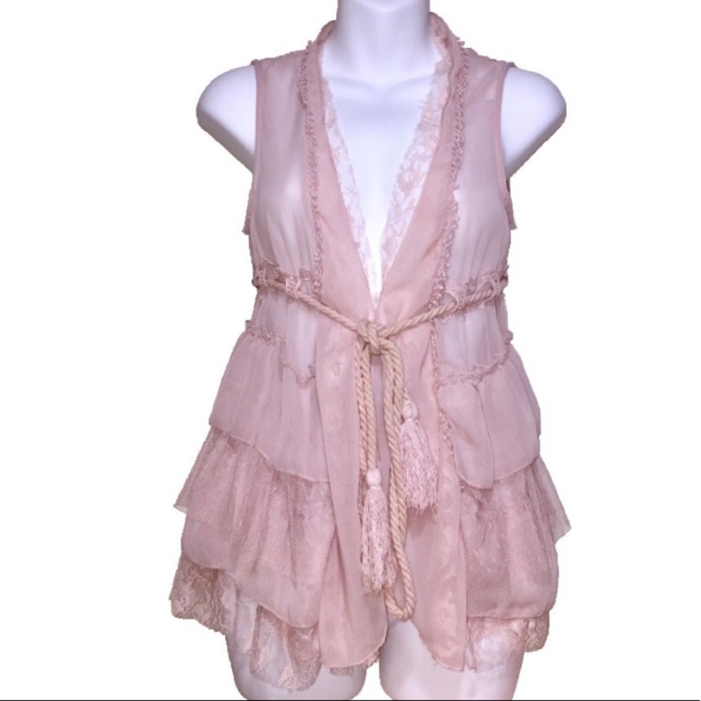 Pale pink throw on sleeveless vest